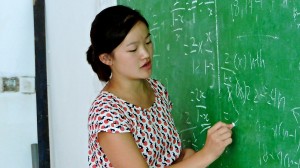 Intern Julie Chen teaching students mathematics