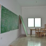 Each classroom is equipped with chalkboards and desks