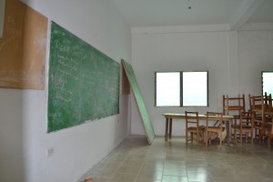 Each classroom is equipped with chalkboards and desks